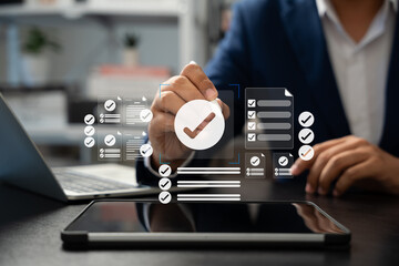 Online survey and checklist assessment, Digital questionnaire, Businessman use tablet to complete a digital form, making evaluation and selecting correct answers marked with check marks.
