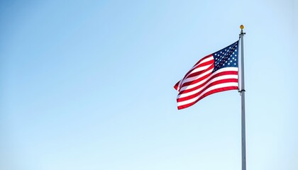 Fototapeta premium Waving American Flag Against Clear Blue Sky