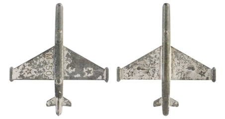 Isolated photo of antique soviet metal m 50 plane toy on white background.