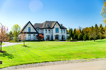 Obraz premium Big House suburb Single Family . Brick house with nice landscape and large green lawn.