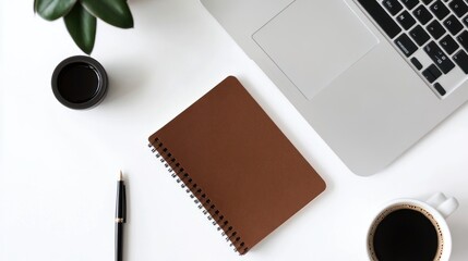 Workspace with laptop and notebook