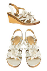 Isolated photo of white leather high heeled woman sandals on white background.