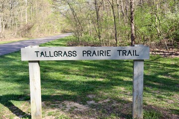 A close view of the old wood trail signpost.