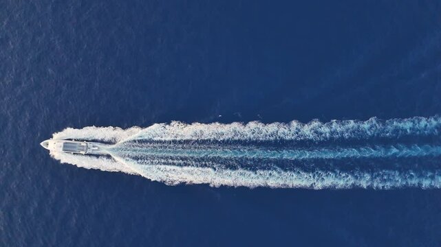 horizontal video white cruise ship sailing through crystal-clear blue waters of the Tyrrhenian Sea in Salerno Bay, Amalfi Coast. Aerial view capturing Italian coastal elegance and maritime charm