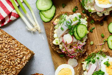 Danish Open-Faced Sandwich with herring on slices of rye bread.top veiw