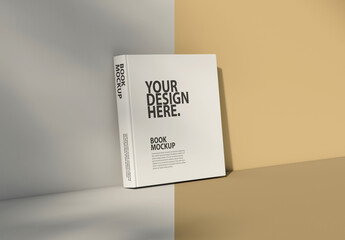 Square book mockup standing on table