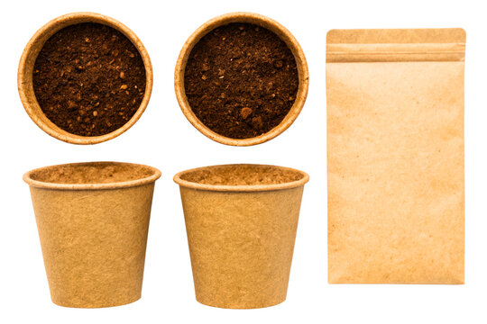 Biodegradable plant pots with soil and a seed packet isolated with transparent background