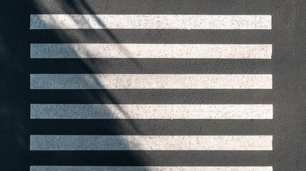 Pedestrian Crossing: An overhead shot shows a classic zebra crossing on a textured pavement, with shadows adding depth. The minimalist design evokes a sense of order and urban transit.