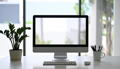 Modern workspace featuring a computer monitor, indoor plants, and a serene background environment