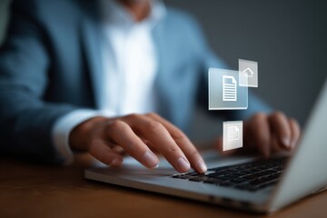 Businessman using laptop computer, engaged in digital tasks with virtual documents appearing on screen, showcasing modern technology and productivity