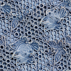 Seamless 4k photo texture of blue colored denim ornate guipure ornament.