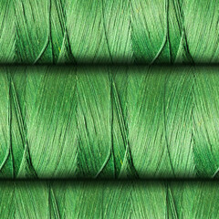 Seamless 4k photo texture of green colored ribbed threads roll surface.