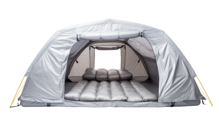 A silver camping tent with an open entrance and sleeping pads inside ready for camping adventure trip