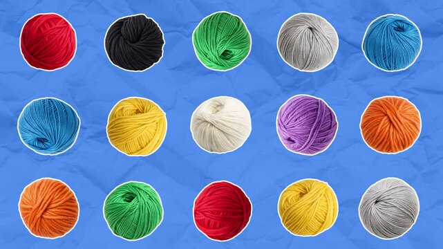 A set of balls of yarn of different colors and sizes appears and moves randomly across the frame. Knitting concept. Stop motion animation on blue paper background