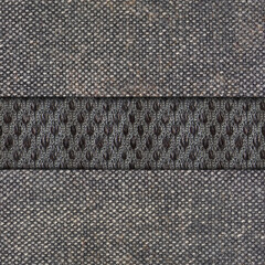 Seamless 4k photo texture material of worn dark gray denim cloth with mesh.