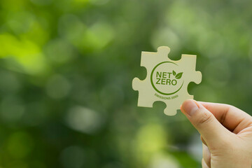 Net zero and carbon neutral concept. greenhouse gas emissions target. Climate neutral long term strategy on a green background.