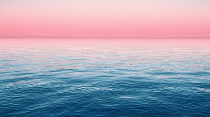 Obraz premium Calm ocean at dawn, soft pink sunrise