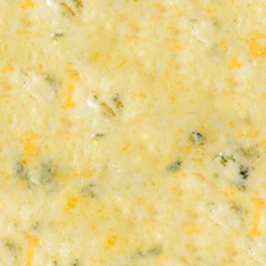 Seamless 4k photo texture material of pizza with mixed cheese crust.