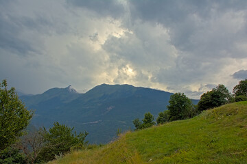 Mountain peaks under a dark stormy sky n La Vanoise national park, Savoie, France 