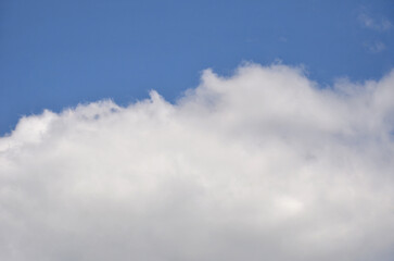 Beautiful background of the sky with partly blue and partly white  large fluffy clouds. Nature ,sky...