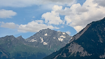 Fototapeta premium Mountains with glaciers under a cloudy sky in La Vanoise national park, Savoie, France