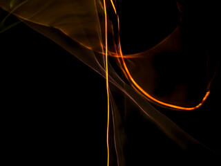 colorful light trails in dark background. Abstract light routes that rotate in vibrant colors....