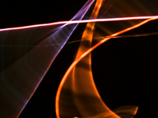colorful light trails in dark background. Abstract light routes that rotate in vibrant colors. Forestry of the blurry movement of light painting. Blurred lights at night. Intentional camera movement, 