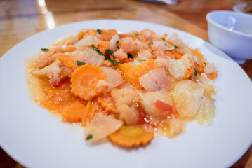 Delicious seafood stir-fry local eatery culinary delight cozy atmosphere close-up taste adventure