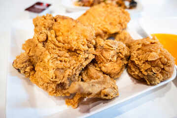 Delicious fried chicken feast restaurant food cozy setting close-up culinary delight