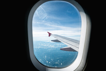 Airplane wing views over scenic landscapes journeying through the sky aerial perspective