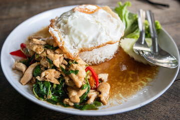Delicious chicken stir-fry with rice and egg street food market culinary delight urban setting close-up view