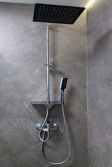Mixer tap and adjustable bracket with two different shower heads
