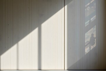 Fototapeta premium Architectural Shadows: Captivating play of light and shadow on a modern interior wall, creating an atmosphere of serenity and minimalist elegance.