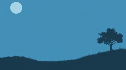 Silhouette of a lone tree on a hill under a full moon in a clear night sky