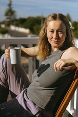 Woman Enjoying Morning Coffee on Home Terrace