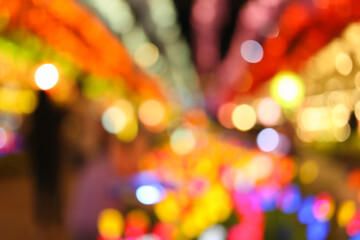 Colorful bokeh circles in the lantern festival in Lamphun, abstract background.