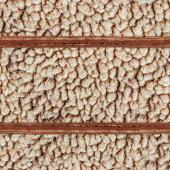 Seamless 4k photo material texture of light brown wool fur with leather straps.