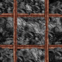 Seamless 4k photo material texture of black disheveled fur with leather straps mesh.