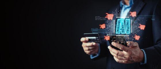 businessman hold a credit card and smartphone display glowing AI and shopping cart icons, symbol...
