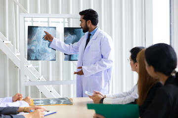 Obraz premium Hospital Medical Research : Group of Doctor, nurse and healthcare professional team meeting sitting in the boardroom, Planning and brainstorming health