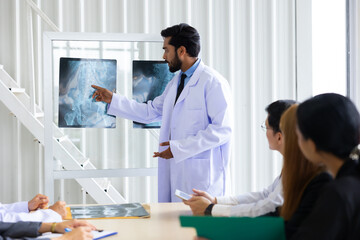 Fototapeta premium Hospital Medical Research : Group of Doctor, nurse and healthcare professional team meeting sitting in the boardroom, Planning and brainstorming health