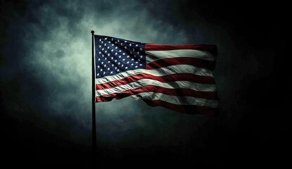 American flag waving in stormy sky