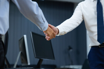 Fototapeta premium businessman shaking hands on business cooperation agreement. Successful Asian businessmen handshaking after good deal. successful negotiate, hand shake celebration partnership and business deal