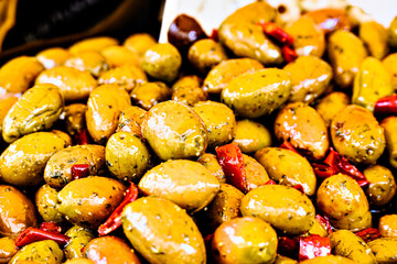 Container with fresh and delicious green olives