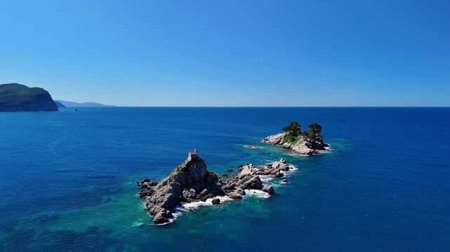 Aerial drone view of the Sveta Nedelja church in Montenegro. A Christian church on a tiny rocky island in the sea near the town of Petrovac.