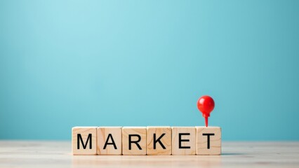 Colorful Market Concept with Wooden Blocks and Red Pin