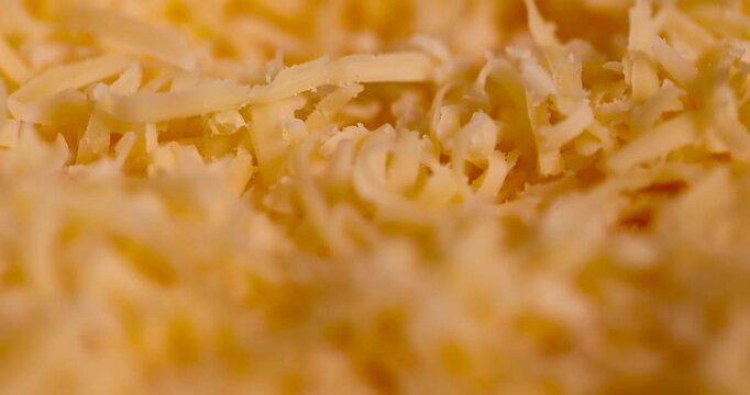 grated cheese of orange color, grated cheese preparation for adding to dishes