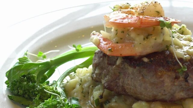Gourmet Grilled Steak with Shrimp, Risotto, and Broccolini