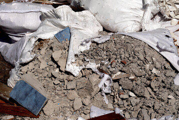 Construction debris in open sacks – illegal disposal of building materials in urban space