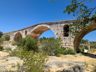 The Pont Julien, famous Roman bridge in Bonnieux, Luberon, France, dates back 2000 years. It spans the Calavon River in three arches